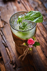 Image showing fresh mojito on a rustic table