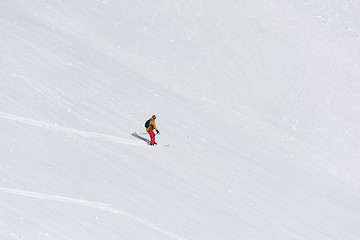 Image showing freeride skier skiing in deep powder snow