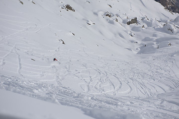 Image showing freeride skier skiing in deep powder snow