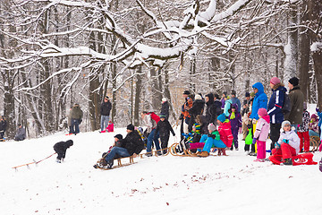 Image showing Winter fun, snow, family sledding at winter time.