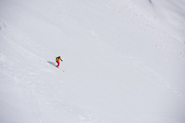 Image showing freeride skier skiing in deep powder snow