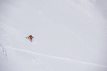 Image showing freeride skier skiing in deep powder snow