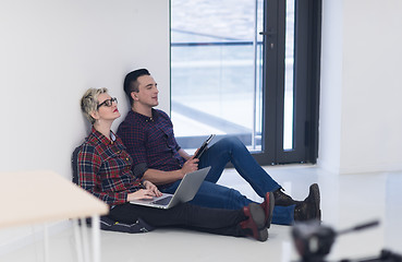 Image showing startup business, couple working on laptop computer at office