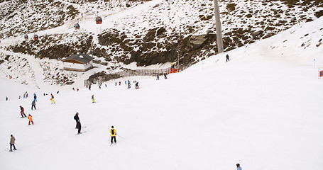 Image showing View from a ski lift of skiers below on run