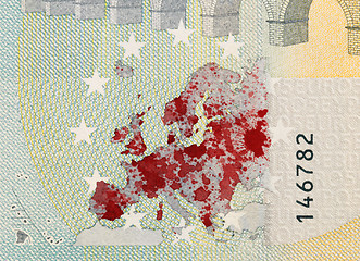Image showing Close-up of a 5 euro bank note, stained with blood