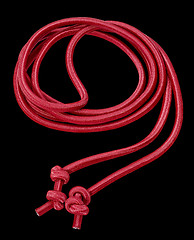 Image showing red rope in black back