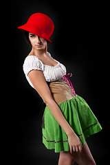 Image showing Pretty girl in german style dress with red hat