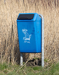 Image showing Close up of bright blue dog mess poop bin