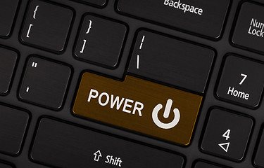 Image showing Brown power button on a black laptop keyboard