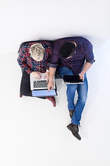 Image showing top view of  couple working on laptop computer at startup office