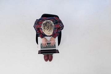 Image showing top view of young business woman working on laptop computer