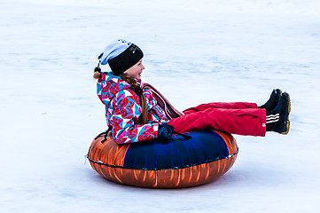 Image showing Baby winter sledding on the Ural River