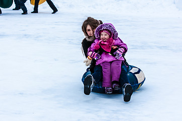 Image showing Baby winter sledding on the Ural River