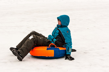 Image showing Baby winter sledding on the Ural River