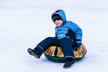 Image showing Baby winter sledding on the Ural River