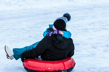 Image showing Baby winter sledding on the Ural River