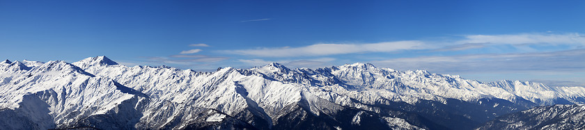 Image showing Large panoramic view on snowy mountains in sunny day