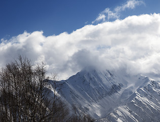 Image showing Winter mountains in clouds at nice day