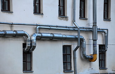 Image showing ventilation pipes on the wall of a building