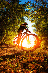 Image showing Man Cyclist with bike on sunset