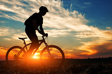 Image showing Silhouette of a man on muontain-bike