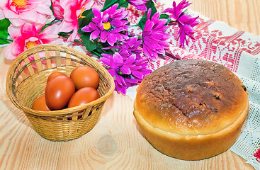 Image showing Easter eggs, cake and artificial flowers.