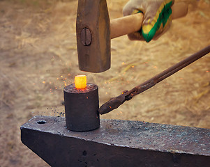 Image showing The hammer, anvil and red-hot the metal.