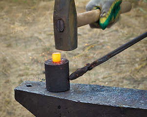 Image showing The hammer, anvil and red-hot the metal.