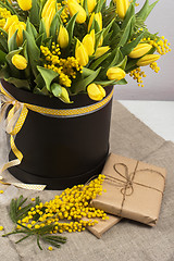 Image showing Bright spring bouquet of tulips and mimosa flowers