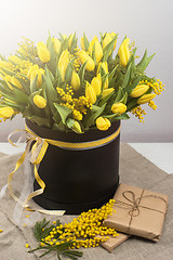 Image showing Bright spring bouquet of tulips and mimosa flowers