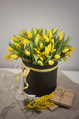 Image showing Bright spring bouquet of tulips and mimosa flowers