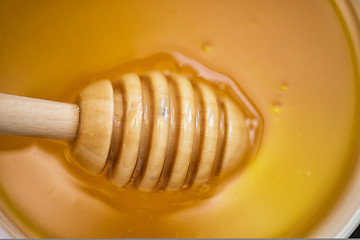 Image showing Honey with wooden spoon