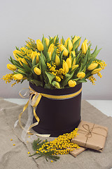 Image showing Bright spring bouquet of tulips and mimosa flowers