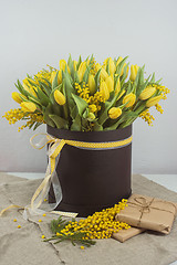 Image showing Bright spring bouquet of tulips and mimosa flowers