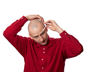 Image showing Young man puts on head headset EEG (electroencephalography)