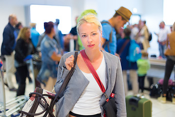Image showing Female traveller waiting in airport terminal.