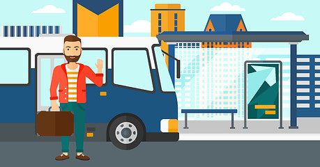 Image showing Man standing near bus.