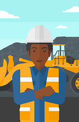 Image showing Miner with mining equipment on background.