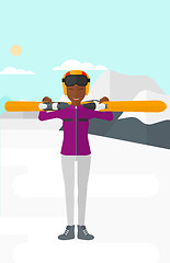 Image showing Woman holding skis.