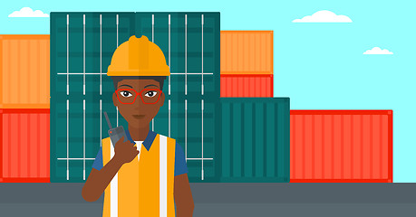 Image showing Stevedore standing on cargo containers background.