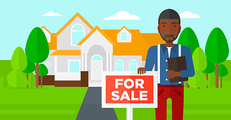 Image showing Real estate agent offering house.