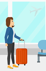 Image showing Woman at airport with suitcase.