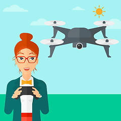 Image showing Woman flying drone.