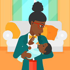 Image showing Woman feeding baby.