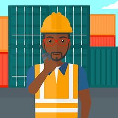 Image showing Stevedore standing on cargo containers background.