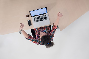 Image showing top view of young business woman working on laptop