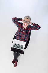 Image showing top view of young business woman working on laptop computer