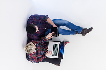 Image showing top view of  couple working on laptop computer at startup office