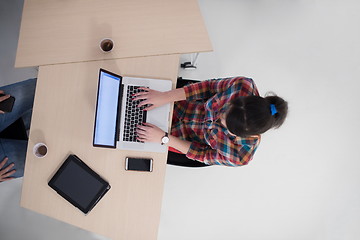 Image showing top view of young business woman working on laptop