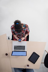 Image showing top view of young business woman working on laptop